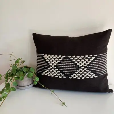 Black Moroccan handmade cushion cover with white stripes and wool decorations