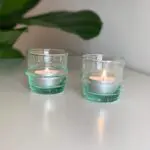 Moroccan handmade glass tealight holders with tealights in them