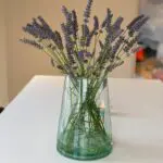 Moroccan hand-blown vase with flowers in it
