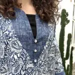 Model in Moroccan handwoven denim dress with leaf pattern, tight
