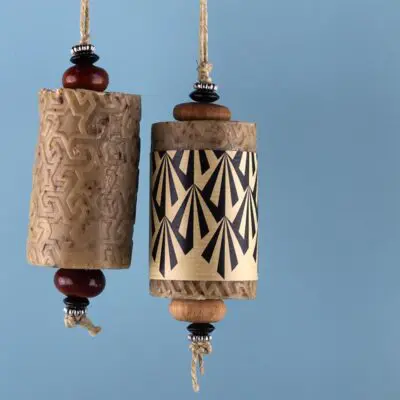 brown L' Art du bain soap rolls that are suspended