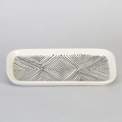 Moroccan dish in white with black stripe pattern