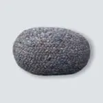 Round Moroccan hand-sewn wool pouf in petrol blue