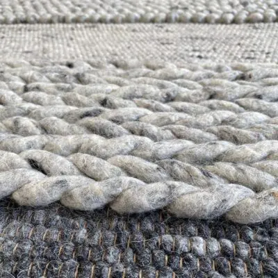 Moroccan handwoven rug in shades of gray and beige with wool details, dense