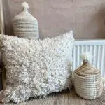 Moroccan handwoven kesh cushion cover in white with decorations around