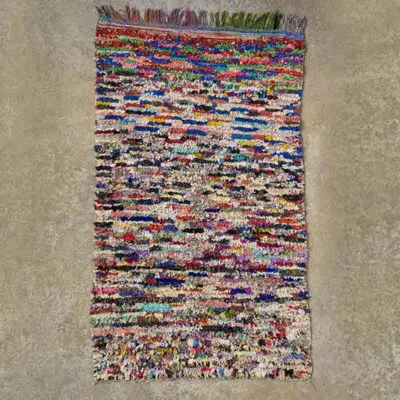 Moroccan handwoven Boucherouite rug with tassels on the sides in a multicolored pattern