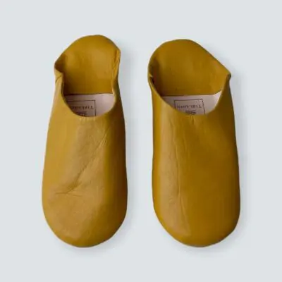 Moroccan handmade slippers in yellow, front view