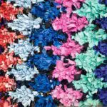 Handwoven boucherouite carpet in multi-coloured diamond pattern