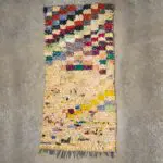 Handwoven boucherouite carpet in multi-coloured Moroccan pattern in beige tones