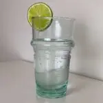 Moroccan hand-blown beldig glass with lime on the rim
