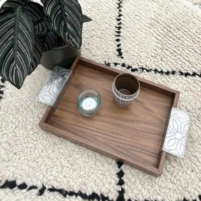 Moroccan handmade tray in walnut wood with inox handles with dishes on top