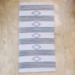 Handwoven cotton rug in beige with Moroccan roots and stripe pattern