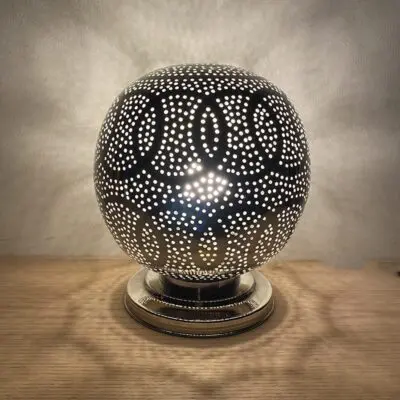 Moroccan handmade table lamp in silver metal with compound rings pattern, lit