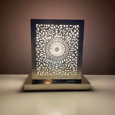 Moroccan handmade square table lamp, lit in the dark