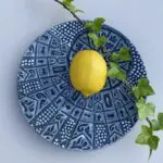 Moroccan hand painted plate with decorations on top