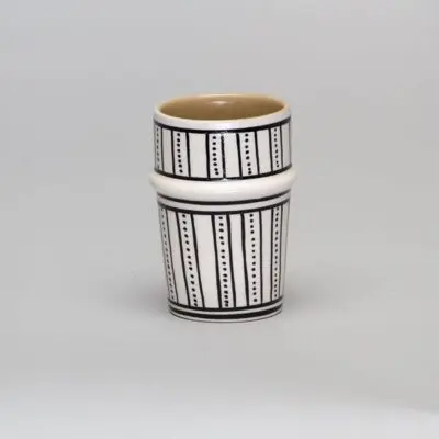 White beldi mug with black dot pattern