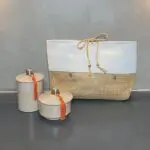 Moroccan handwoven toilet bag in gray and beige with stucco jars on the side