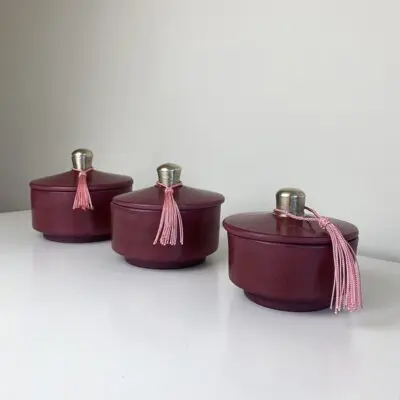 Bordeaux round low Moroccan handmade stucco jars with pink tassels