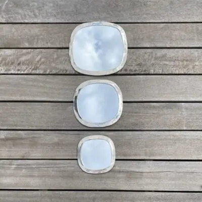 Three Moroccan handmade mirrors in silver metal with square rounded shapes in different sizes