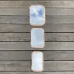 Three rectangular Moroccan handmade mirrors with rounded edges of rose gold metal in different variants