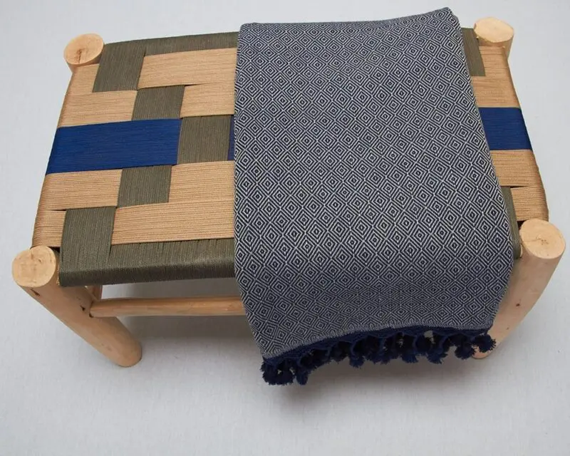 Moroccan stool with a plaid on top
