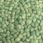 Round Moroccan hand-sewn wool pouf in green, dense