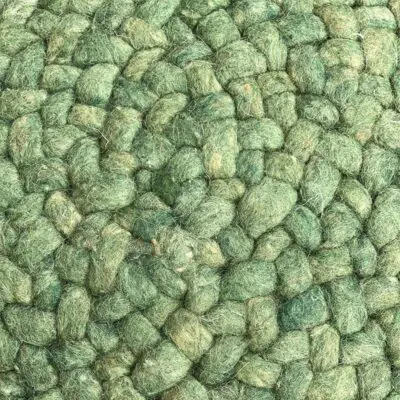 Round Moroccan hand-sewn wool pouf in green, dense
