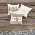 Moroccan handwoven cushion covers lying on wooden stairs