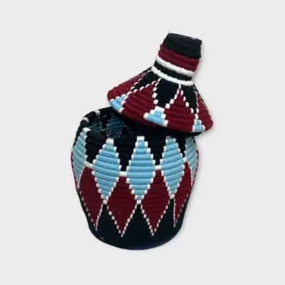 Berber basket with diamond-shaped pattern in blue and red colors