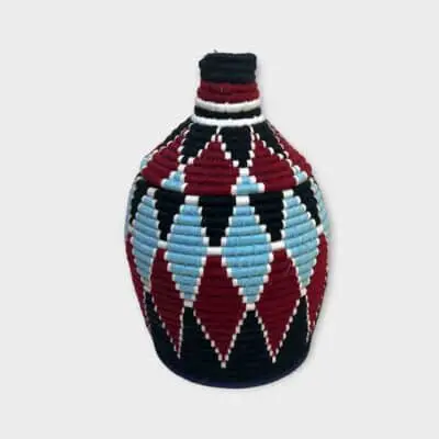 Berber basket with diamond-shaped pattern in blue and red colors