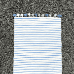 Bath Mat Light Blue 1.png Moroccan handwoven bath mat in white with light blue stripes