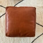 Moroccan pouf in leather. square- reddish brown