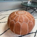 Moroccan pouffe in light brown leather with a slat in the middle 50 cm in diameter