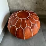 Moroccan pouf in a light cognac color without a pattern in the middle