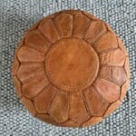 Light brown pouf with white stitches
