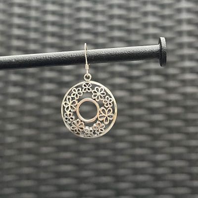 Beautiful O-shaped earrings handmade from sterling silver in Tiznit, Morocco. Features detailed Moroccan carvings.