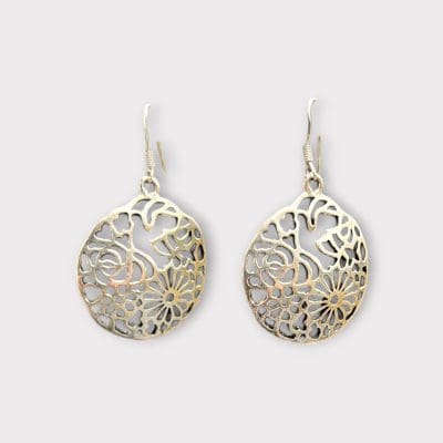 Unique round dangle earrings in genuine silver with beautiful Moroccan carvings. Handmade in Tiznit, Morocco.