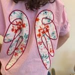 Angel blush shirt in roze met witte strepen en opgestikte engelenvleugels op de rug