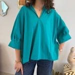 Shirt ANGEL TIDE_ turquoiseblauw shirt met opgenaaide engelenvleugels op de rug