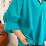 Shirt ANGEL TIDE_ turquoiseblauw shirt met opgenaaide engelenvleugels op de rug