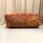 Coussin de sol _AMOUD dans les tons rouge brûlé et orange