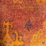 Coussin de sol _AMOUD dans les tons rouge brûlé et orange