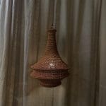 Crochet lamp rust colored in three sizes. Crocheted in nylon yarn