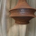 Crochet lamp rust colored in three sizes. Crocheted in nylon yarn