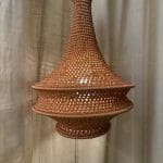Crochet lamp rust colored in three sizes. Crocheted in nylon yarn
