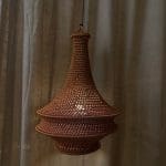 Crochet lamp rust colored in three sizes. Crocheted in nylon yarn