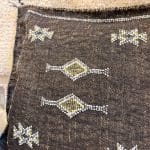 Deep mocha brown colored cactus silk pillowcases. This one with yellow and white details.