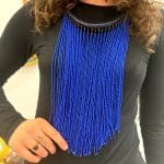 Pearl necklace with blue pearls and dark blue necklace in braided leather.