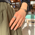 Fine, elegant ring. Narrow with discreet pink oblong stone and fine silver details.