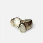 Beautiful silver ring with bright teardrop-shaped stones that sit opposite each other.